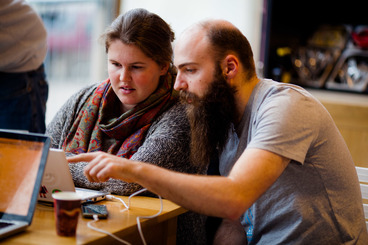 Guy and a girl looking at a laptop